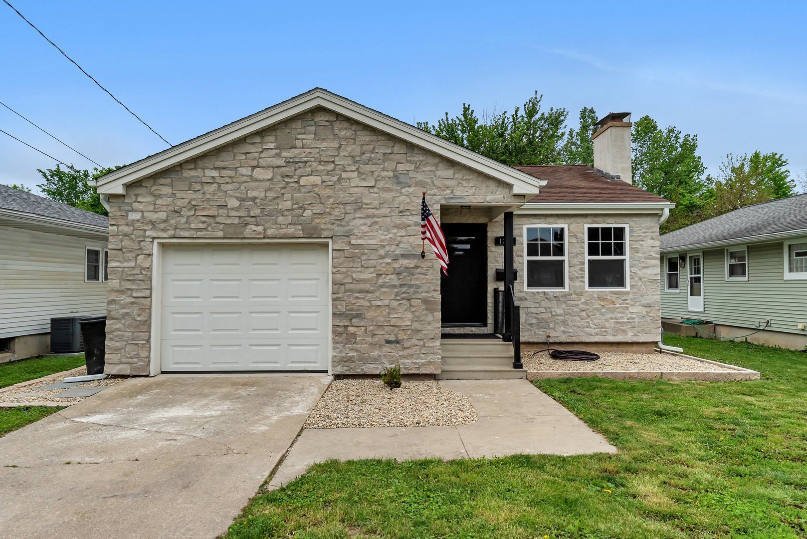 1314 West Washington Street Ottawa, IL 61350 - Photo 2 of 21 a front view of a house with a garden