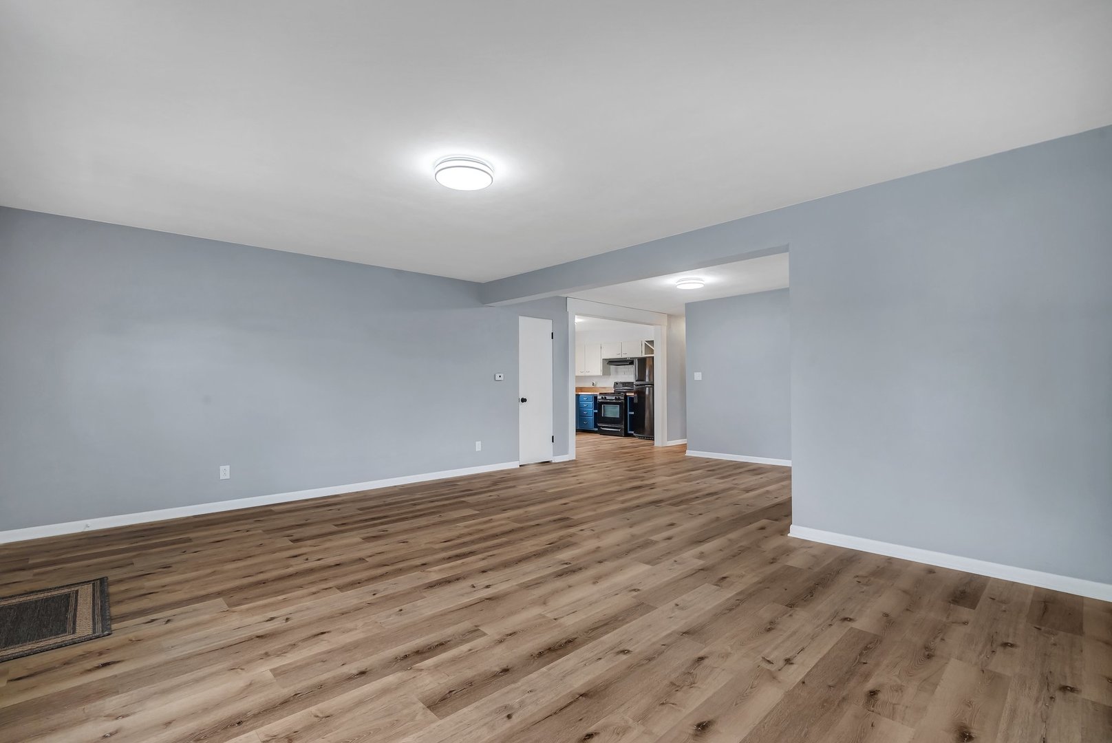 1314 West Washington Street Ottawa, IL 61350 - Photo 3 of 21 a view of empty room with wooden floor