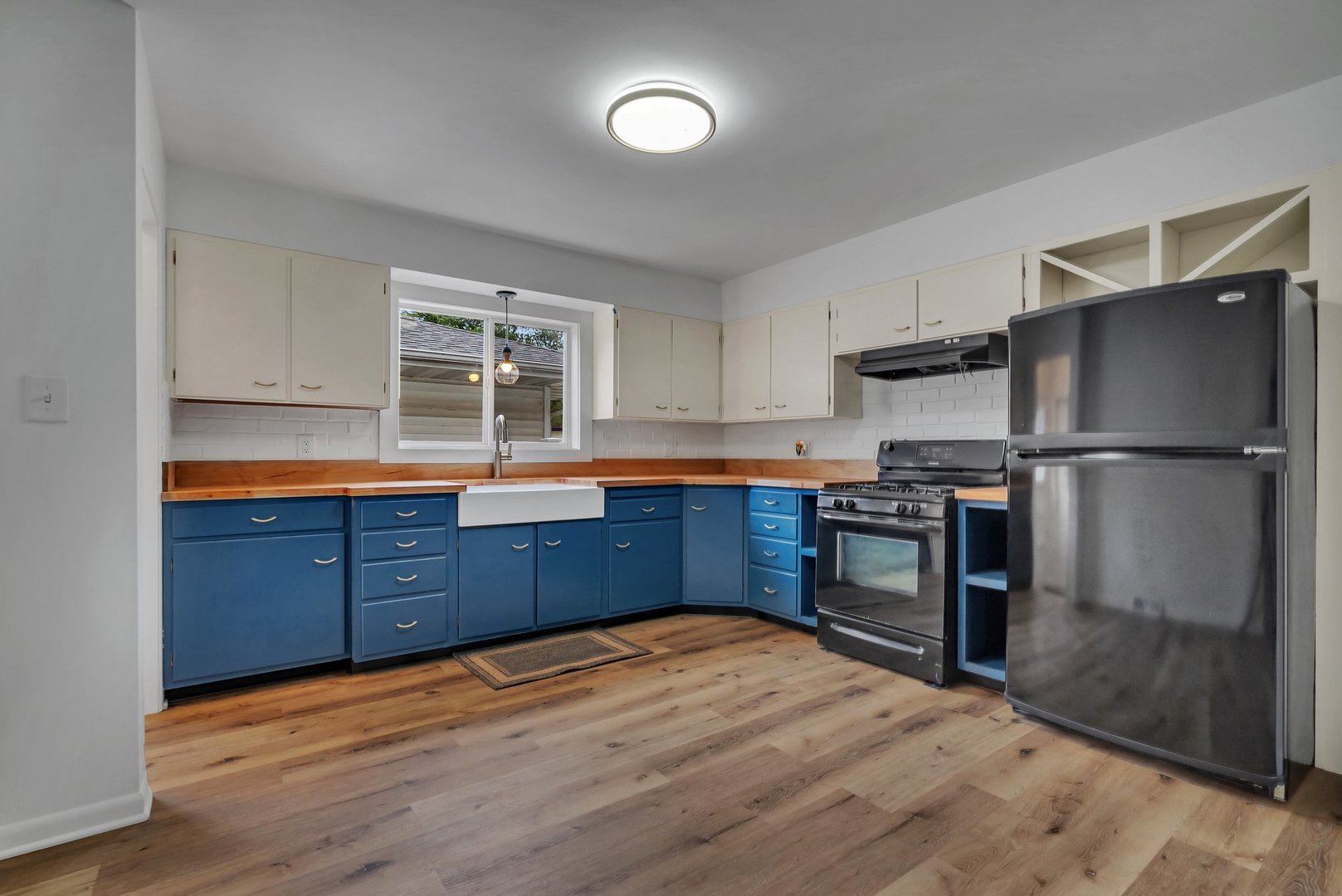 1314 West Washington Street Ottawa, IL 61350 - Photo 8 of 21 a kitchen with stainless steel appliances granite countertop a refrigerator and a stove top oven