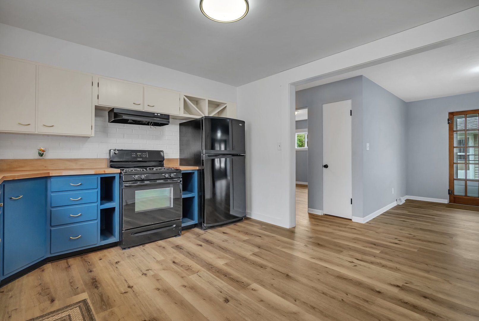 1314 West Washington Street Ottawa, IL 61350 - Photo 10 of 21 a kitchen with stainless steel appliances kitchen island wooden cabinets and granite counter tops