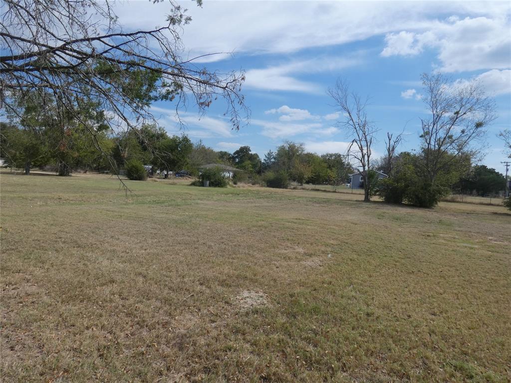 0 Hawkins Street Terrell, TX 75160 - Photo 2 of 6 a view of a field with trees in background