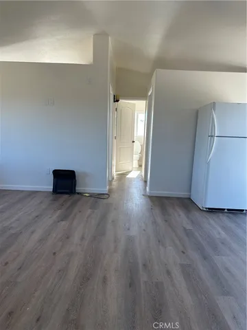 a view of a livingroom with wooden floor