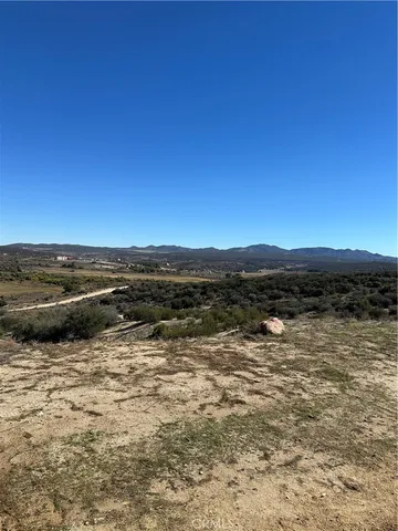 a view of a lake with sunset