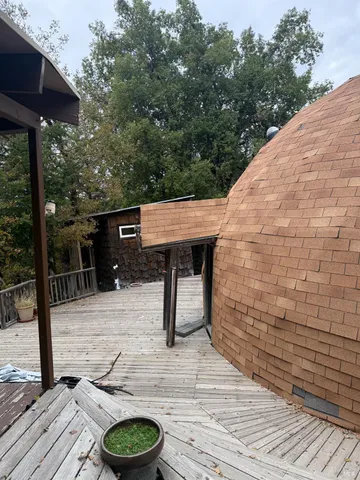 a view of a wooden floor with a table and chairs