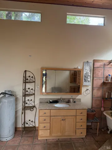 a bathroom with a sink and a large mirror