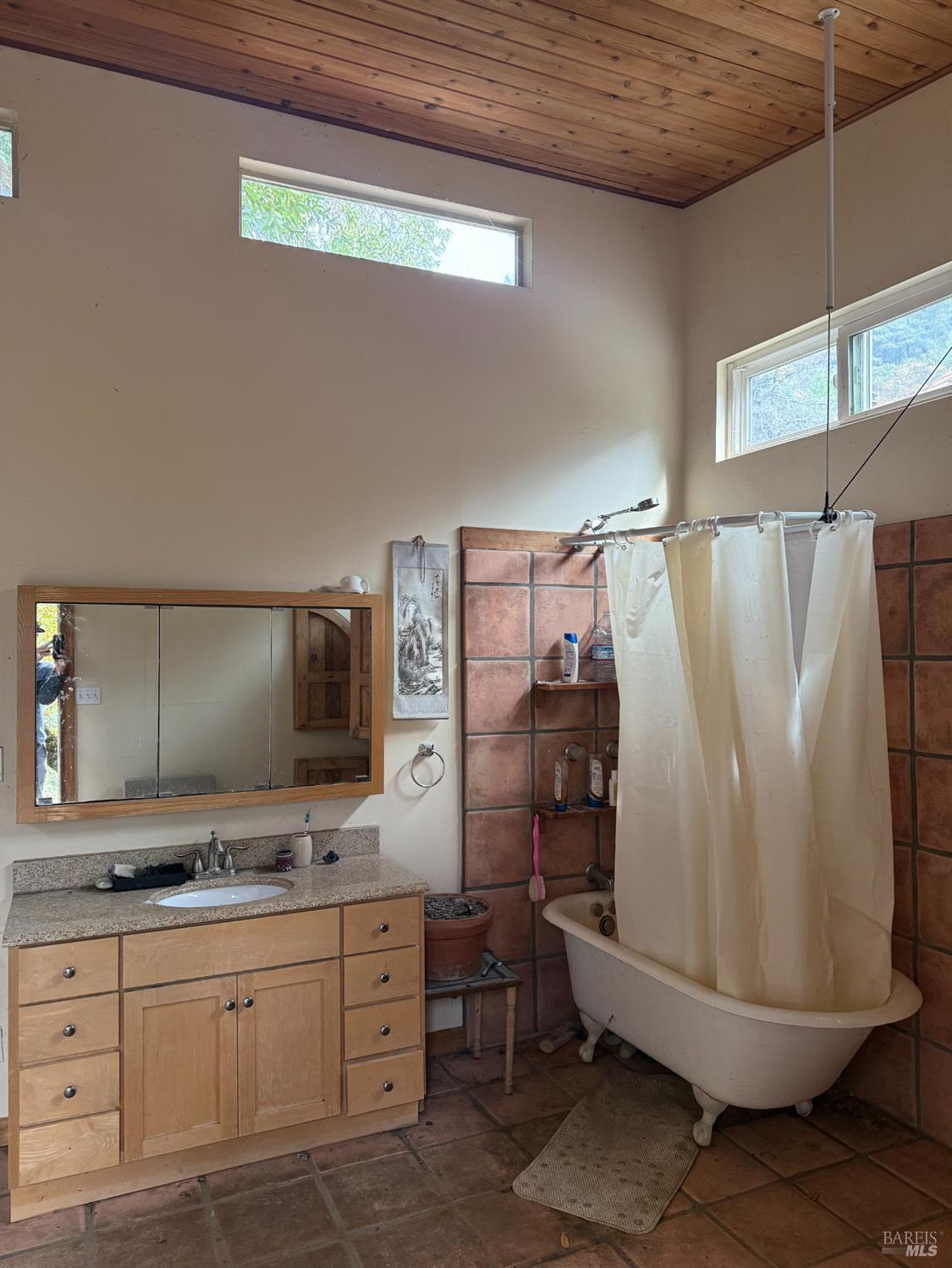6565 Spyrock Road Laytonville, CA 95454 - Photo 17 of 42 a bathroom with a double vanity sink toilet and mirror
