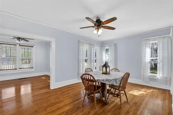 a dining room with furniture and window