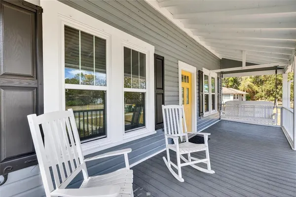 a view of a chair and table in the balcony