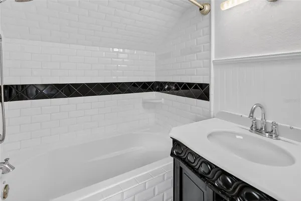 a bathroom with a sink and a bathtub