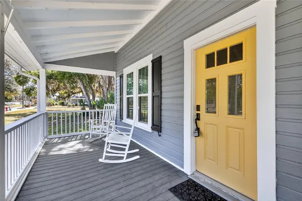 a view of outdoor space with deck and furniture