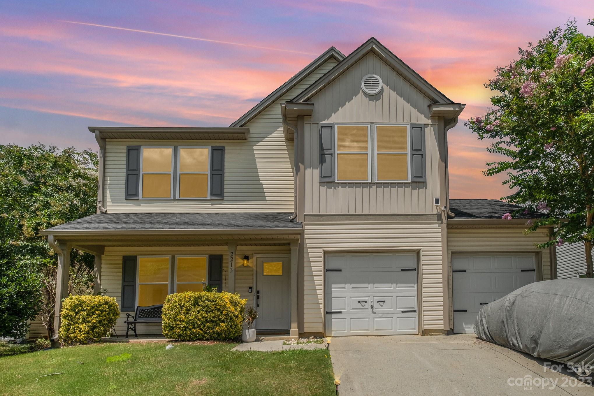 a front view of a house with garden