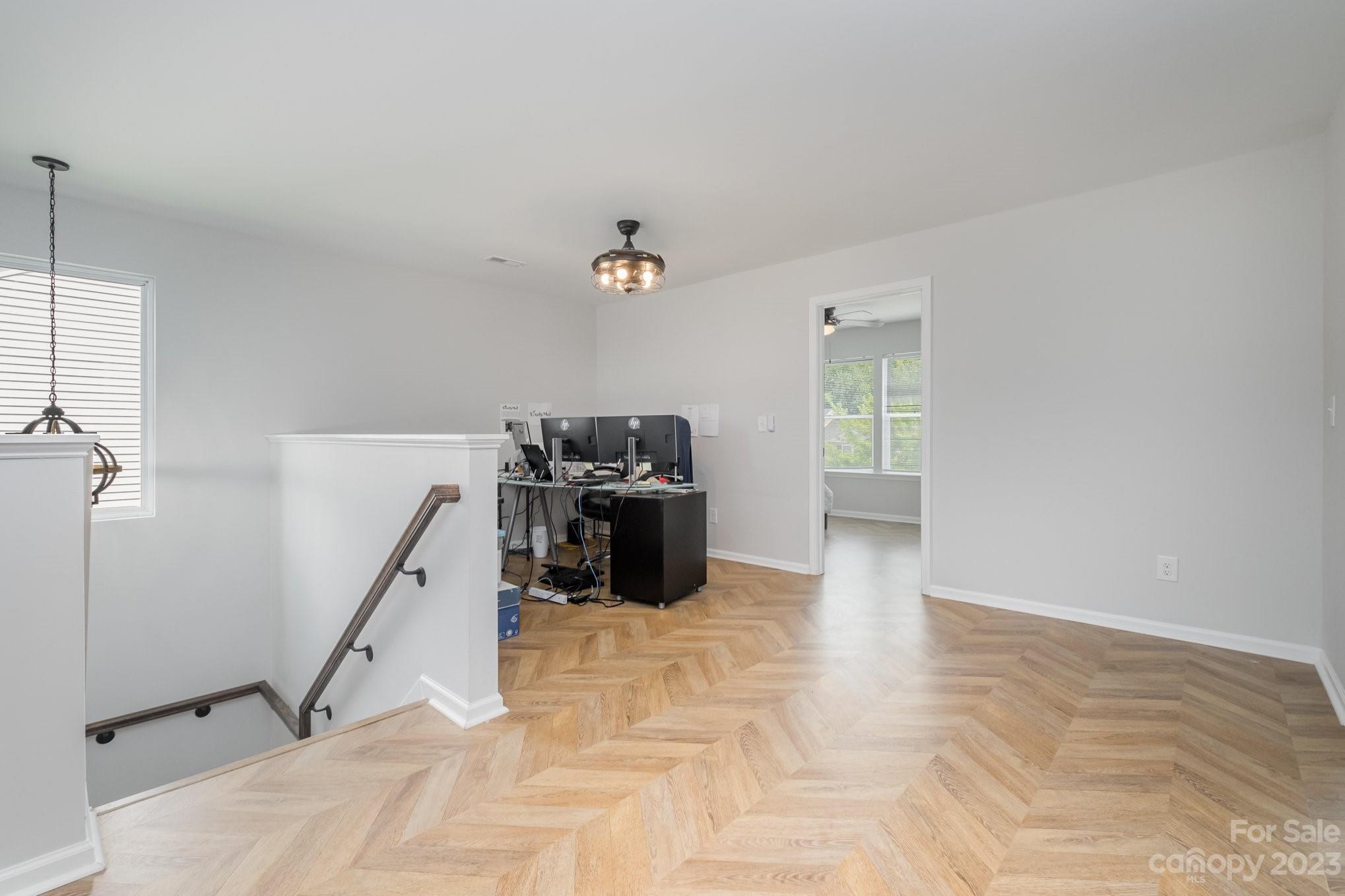 2213 Turtle Point Road Charlotte, NC 28262 - Photo 15 of 28 a view of a workspace with furniture and a window