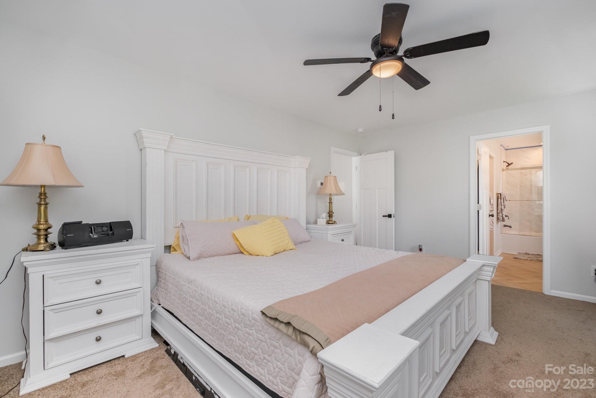 2213 Turtle Point Road Charlotte, NC 28262 - Photo 18 of 28 a bedroom with a bed and a dresser
