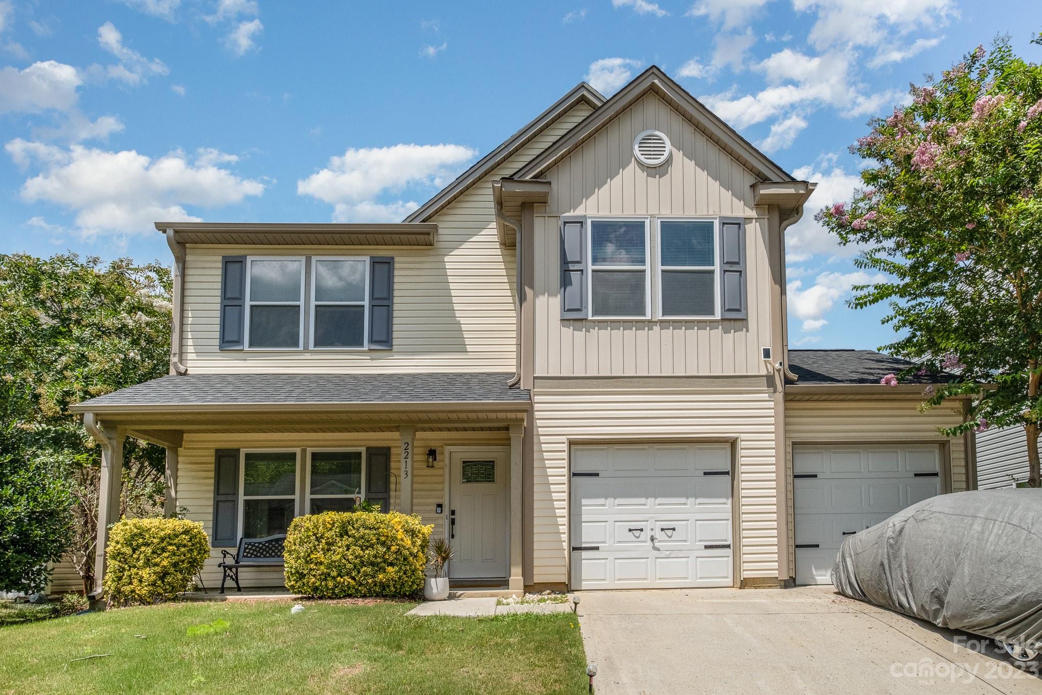 2213 Turtle Point Road Charlotte, NC 28262 - Photo 2 of 28 a front view of a house with garden