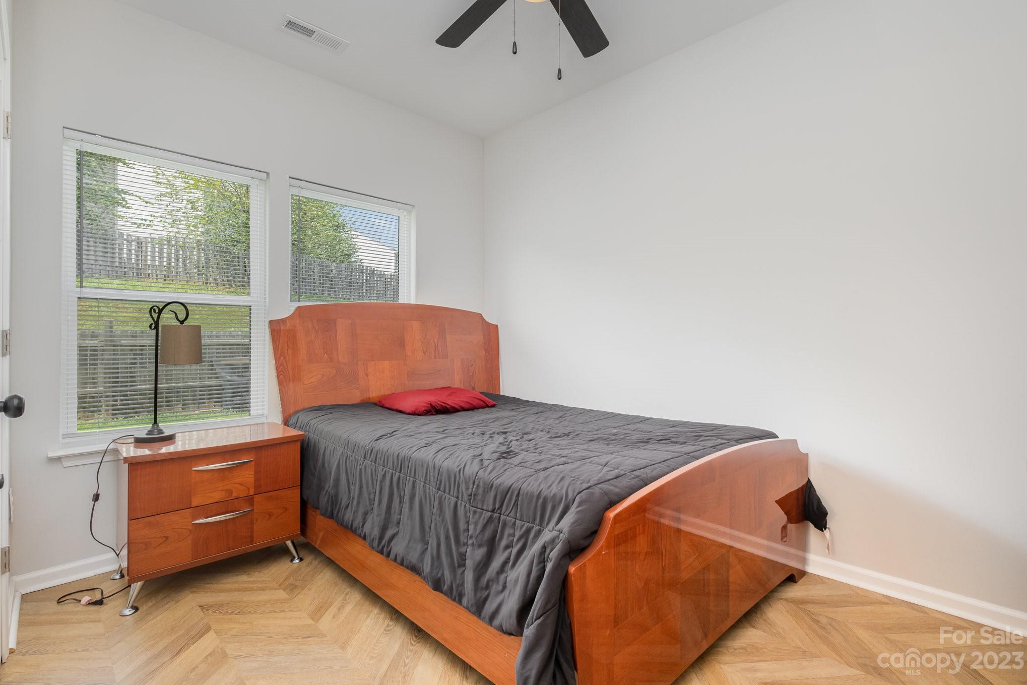 2213 Turtle Point Road Charlotte, NC 28262 - Photo 22 of 28 a bedroom with a bed and window