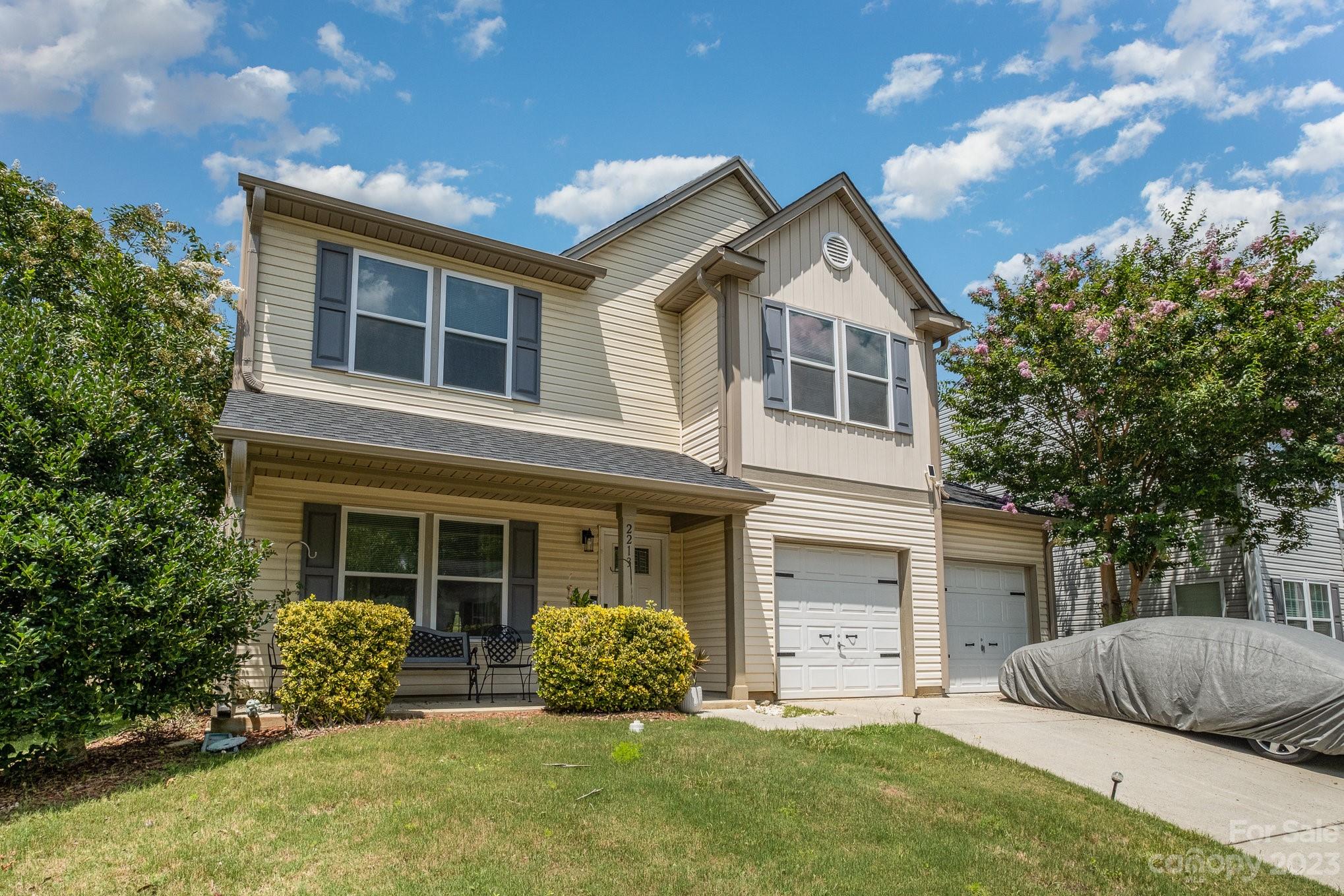 2213 Turtle Point Road Charlotte, NC 28262 - Photo 4 of 28 a front view of a house with a yard and garage
