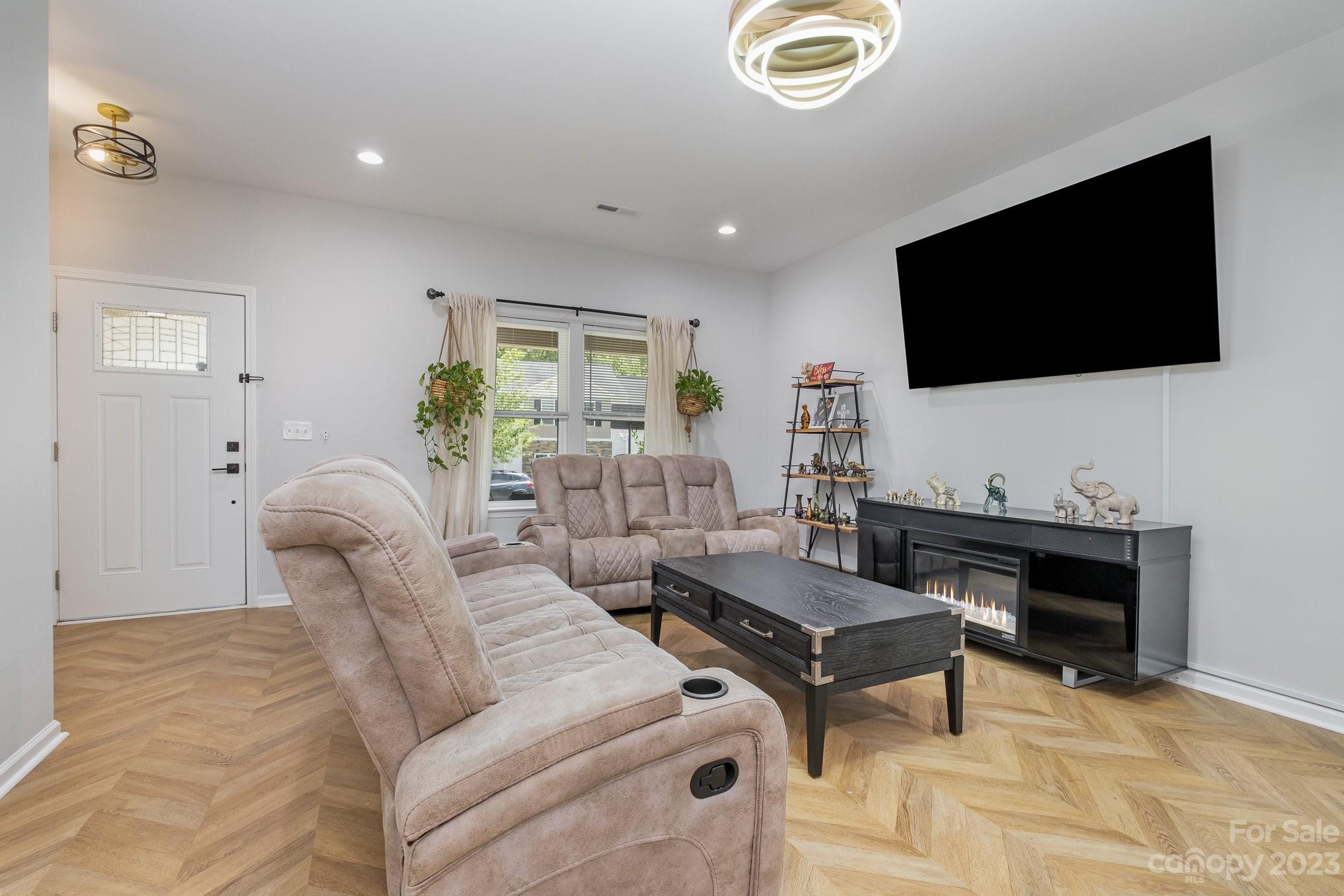 2213 Turtle Point Road Charlotte, NC 28262 - Photo 6 of 28 a living room with furniture and a flat screen tv