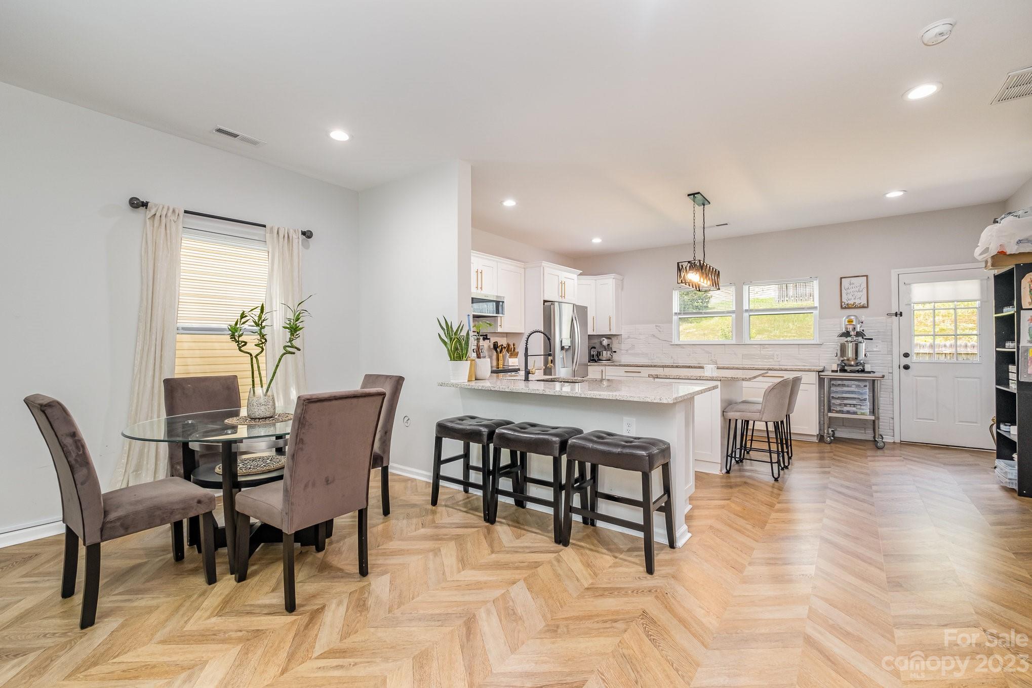 2213 Turtle Point Road Charlotte, NC 28262 - Photo 8 of 28 a view of a dining room with furniture and a kitchen