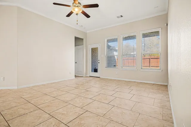 a view of an empty room with a window