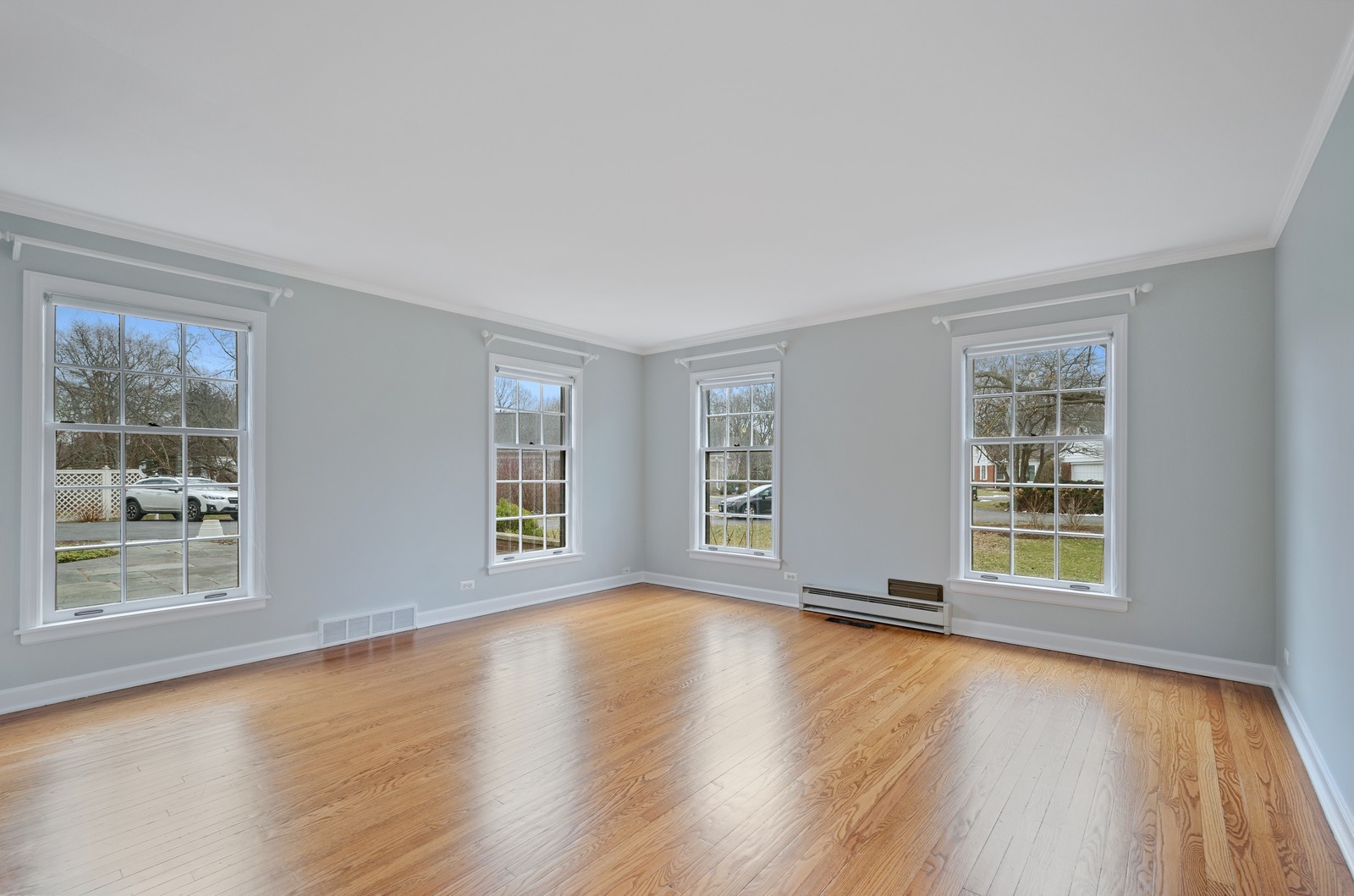 1347 Hackberry Lane Winnetka, IL 60093 - Photo 11 of 25 a view of an empty room with wooden floor and a window