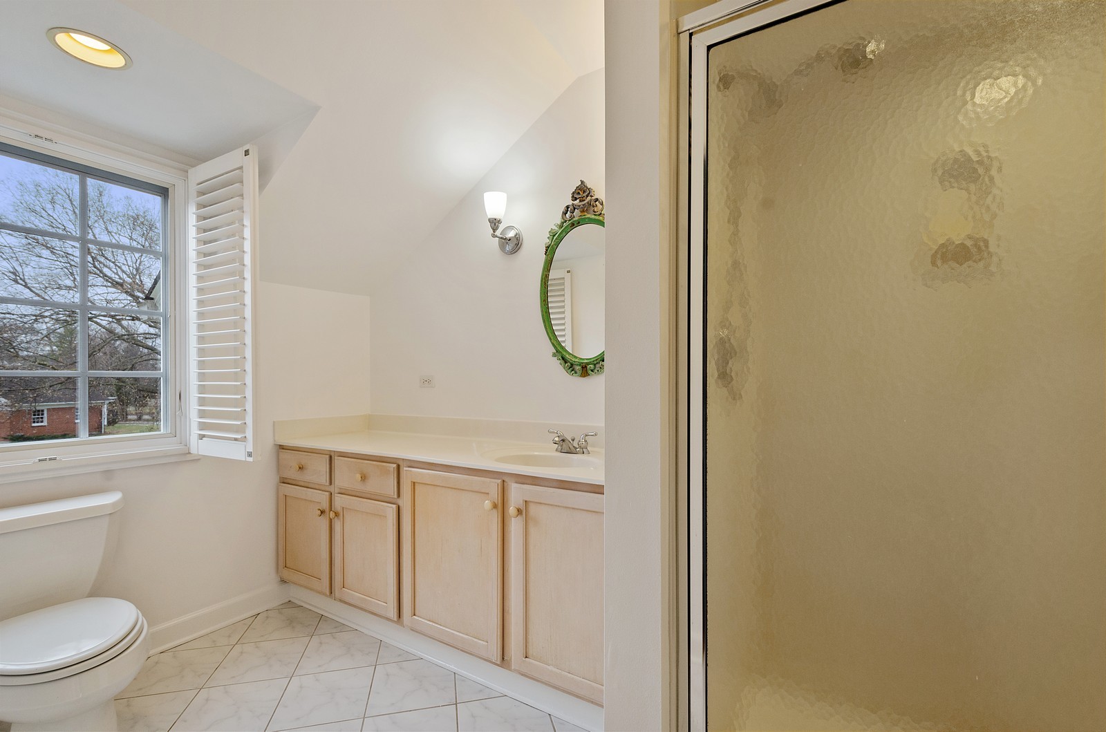 1347 Hackberry Lane Winnetka, IL 60093 - Photo 14 of 25 a bathroom with a granite countertop sink a toilet and a shower