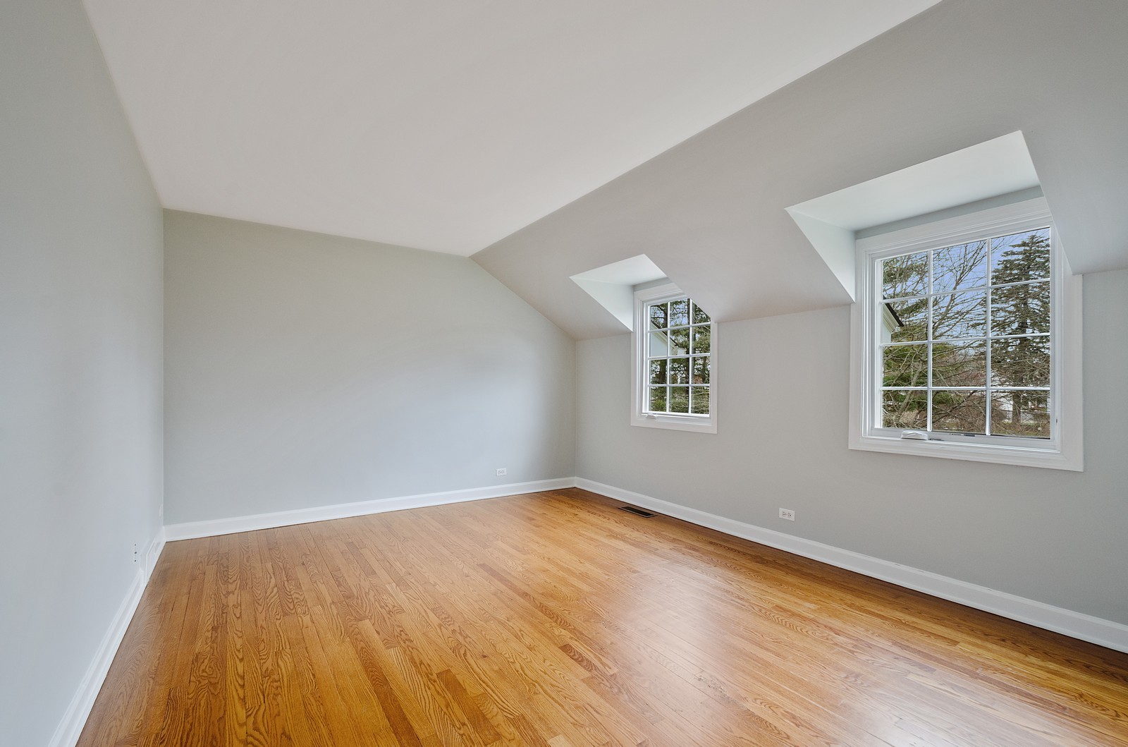 1347 Hackberry Lane Winnetka, IL 60093 - Photo 16 of 25 an empty room with wooden floor and windows