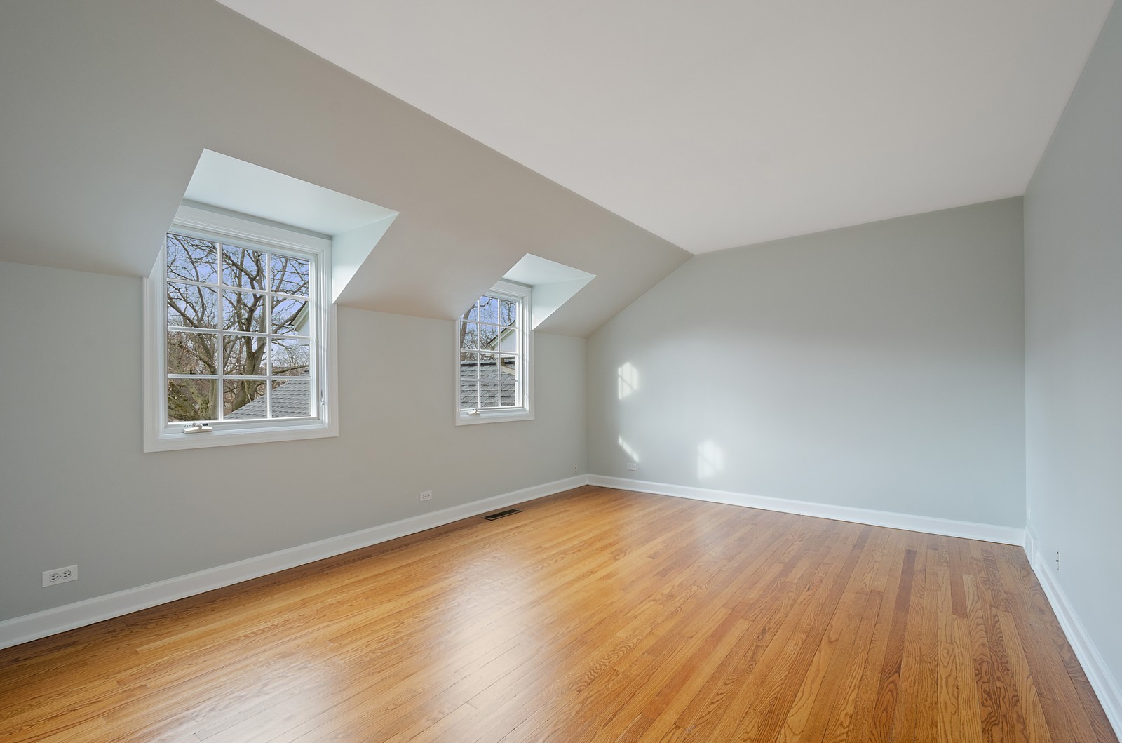 1347 Hackberry Lane Winnetka, IL 60093 - Photo 17 of 25 a view of empty room with wooden floor and fan
