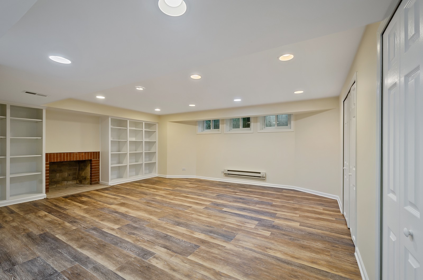 1347 Hackberry Lane Winnetka, IL 60093 - Photo 19 of 25 a view of empty room with a fireplace and cabinet
