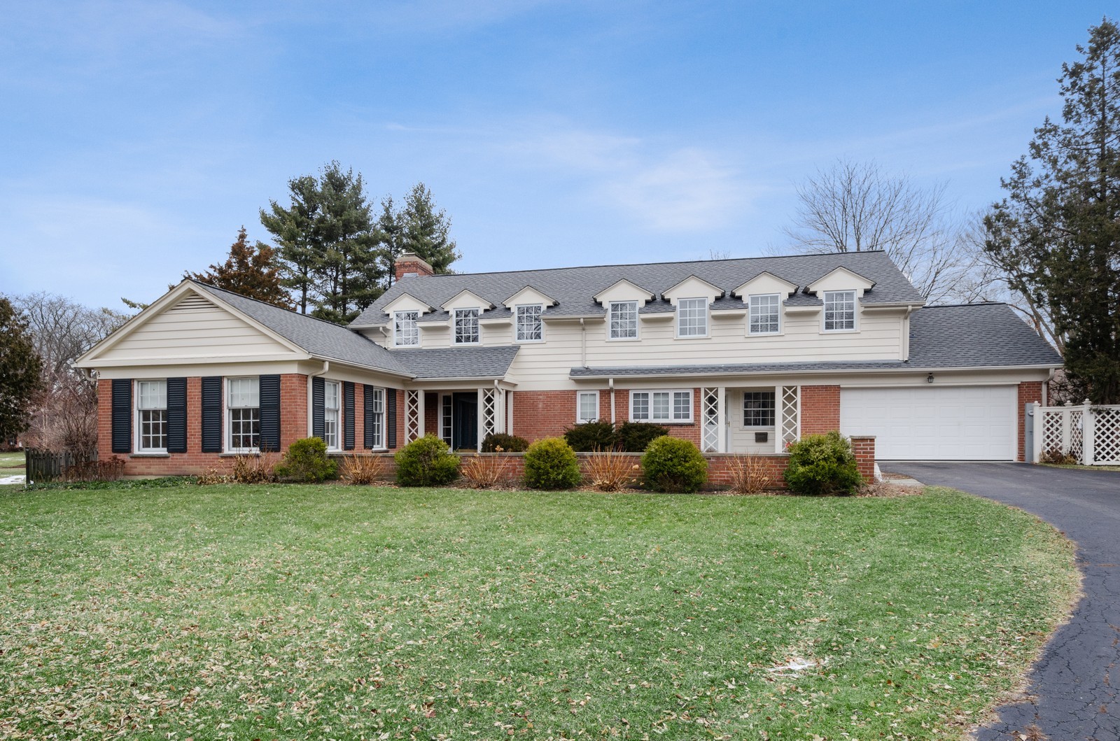 1347 Hackberry Lane Winnetka, IL 60093 - Photo 2 of 25 a front view of a house with garden