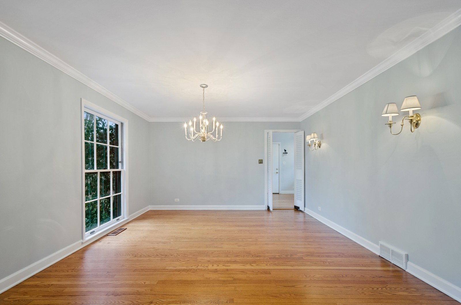 1347 Hackberry Lane Winnetka, IL 60093 - Photo 5 of 25 wooden floor in an empty room with a window