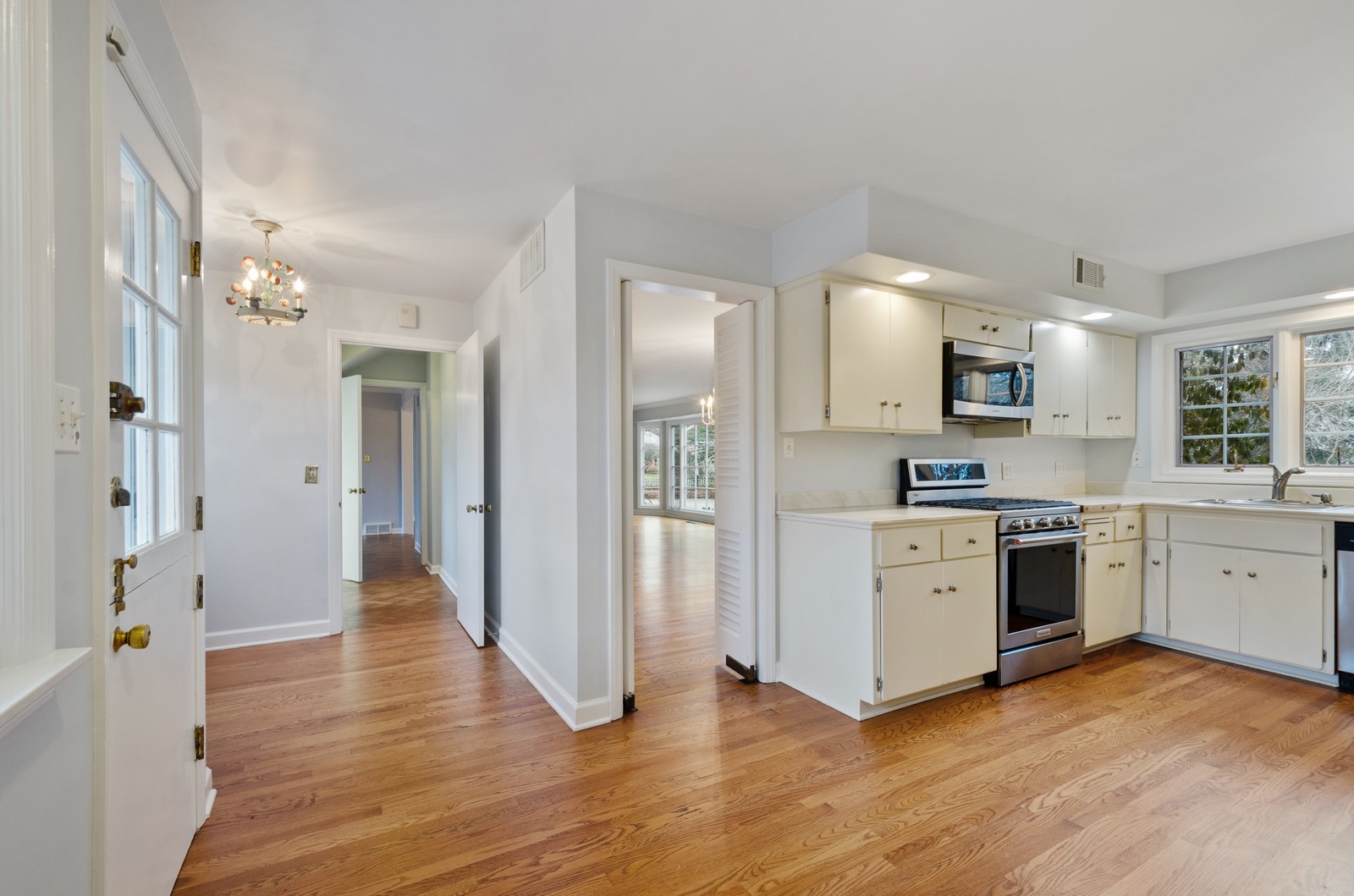 1347 Hackberry Lane Winnetka, IL 60093 - Photo 7 of 25 a kitchen with cabinets and wooden floor