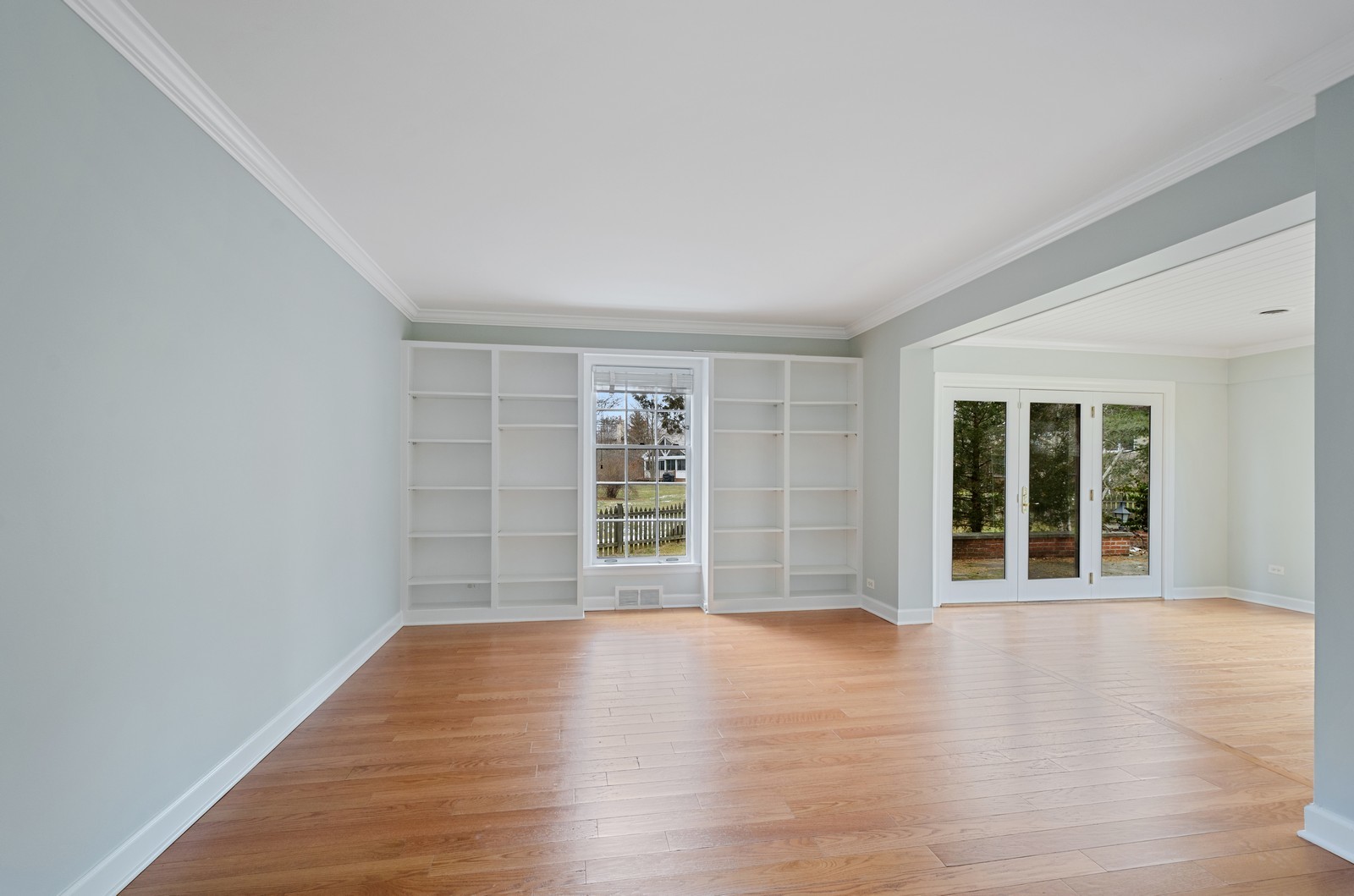 1347 Hackberry Lane Winnetka, IL 60093 - Photo 10 of 25 wooden floor in an empty room with a window