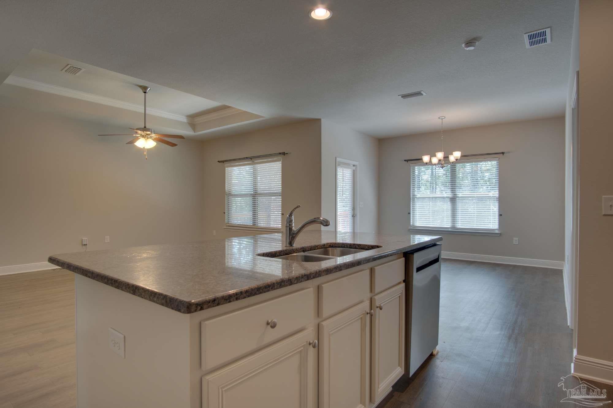 6239 Ladera Trail Pace, FL 32571 - Photo 11 of 27 a kitchen with a sink and cabinets
