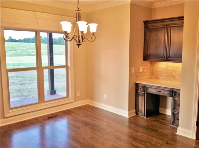 821 Double Log Cabin Road Lebanon, TN 37087 - Photo 15 of 16 a view of empty room with wooden floor and fireplace