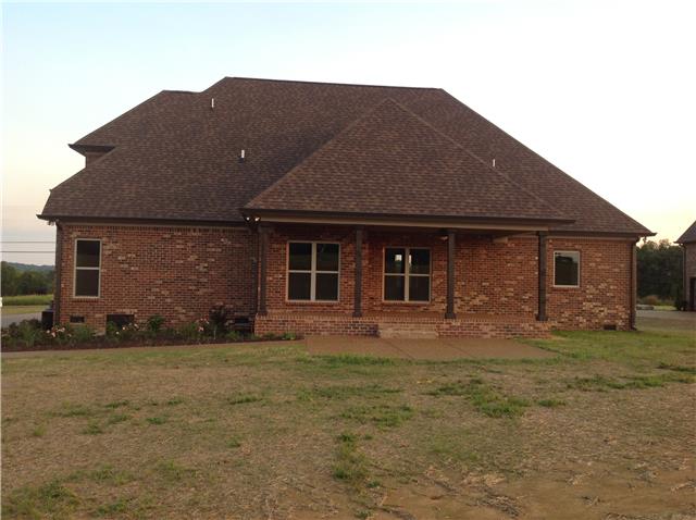 821 Double Log Cabin Road Lebanon, TN 37087 - Photo 2 of 16 a front view of a house with a garden