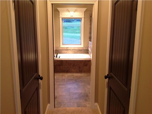 821 Double Log Cabin Road Lebanon, TN 37087 - Photo 6 of 16 a bathroom with a glass door