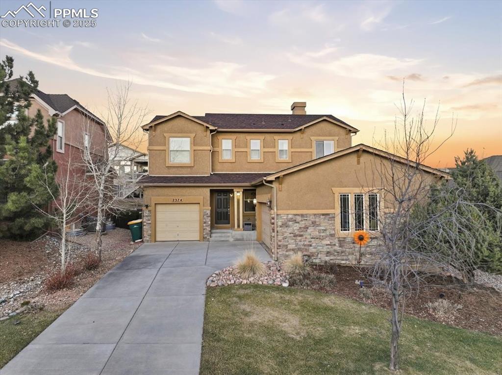 2374 Cinnabar Road Colorado Springs, CO 80921 - Photo 1 of 50 This beautiful two-story stone and stucco home is just steps from Barefoot Park in Flying Horse.