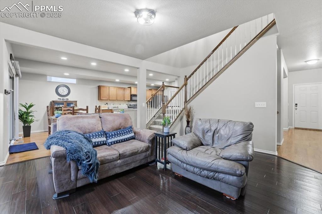2374 Cinnabar Road Colorado Springs, CO 80921 - Photo 15 of 50 The living room is spacious and filled with natural light.