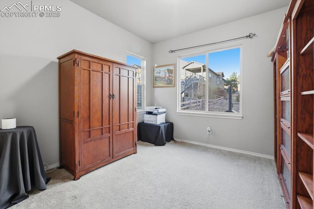 2374 Cinnabar Road Colorado Springs, CO 80921 - Photo 19 of 50 This separate office is located in the back of the main level and could also be used as a bedroom if needed.