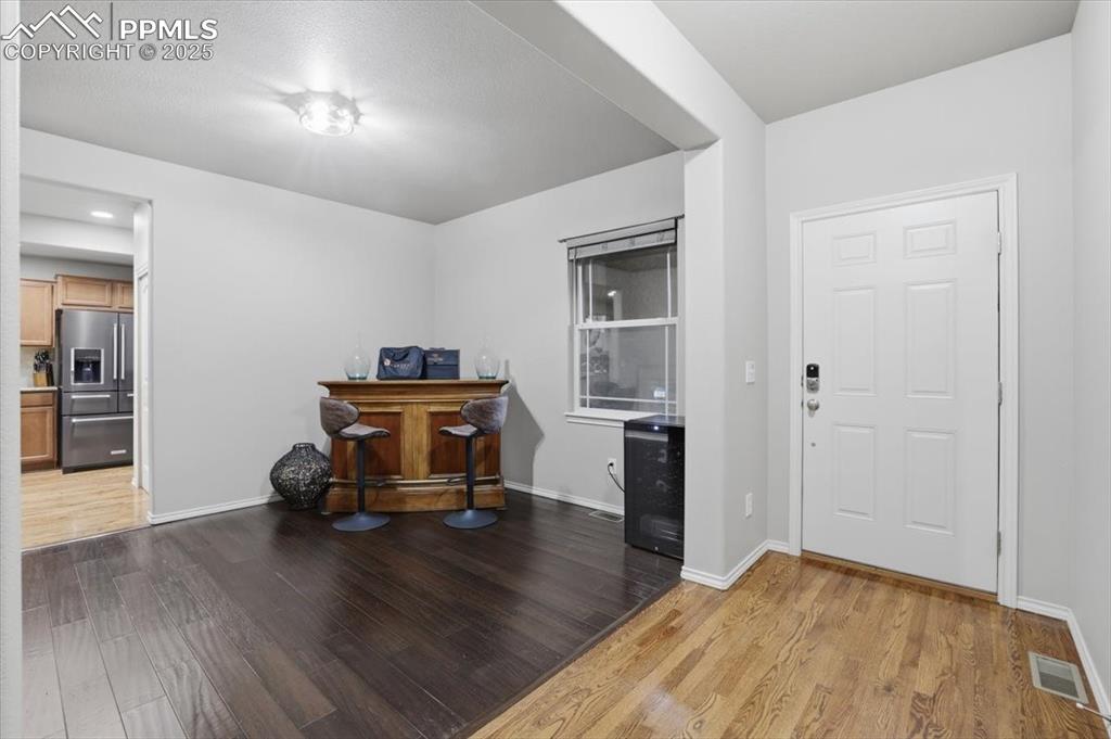 2374 Cinnabar Road Colorado Springs, CO 80921 - Photo 3 of 50 The entry is open to the formal dining room, which could also be used as an office.