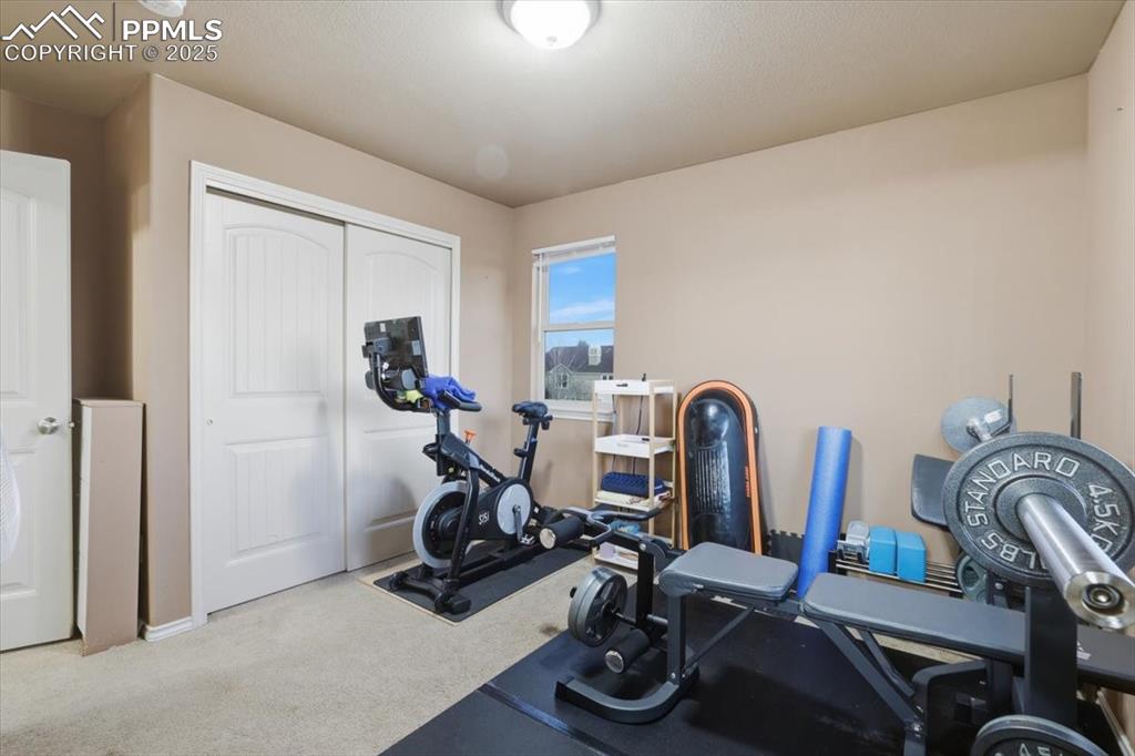 2374 Cinnabar Road Colorado Springs, CO 80921 - Photo 36 of 50 The fourth upper level bedroom is a junior suite with a private bath and a double closet.