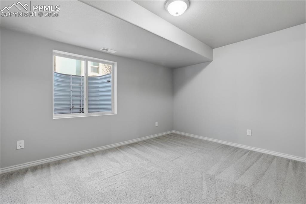 2374 Cinnabar Road Colorado Springs, CO 80921 - Photo 43 of 50 This basement-level bedroom gets lots of light from the double window and also has a double closet.
