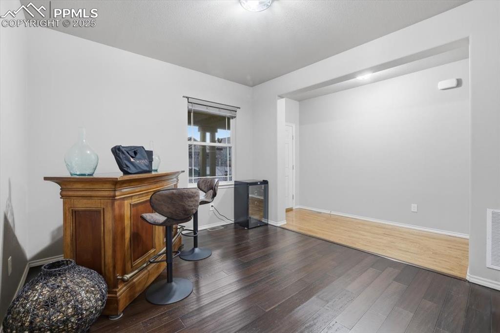 2374 Cinnabar Road Colorado Springs, CO 80921 - Photo 5 of 50 The formal dining room connects to the kitchen and could also be used as an office.