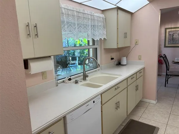 a kitchen with a sink and a cabinets