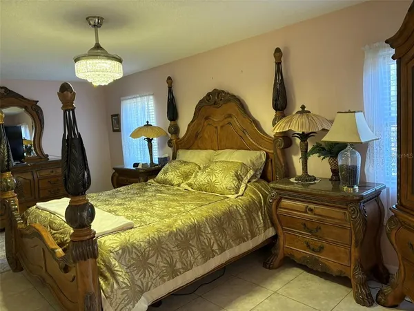 a bedroom with a bed and dresser