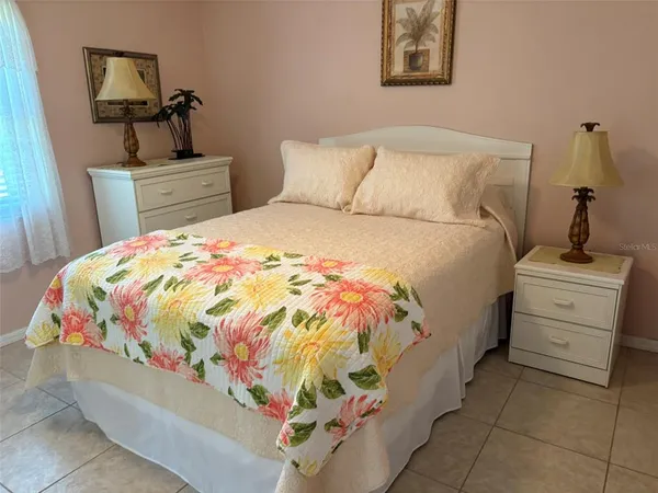 a bedroom with a bed and dresser