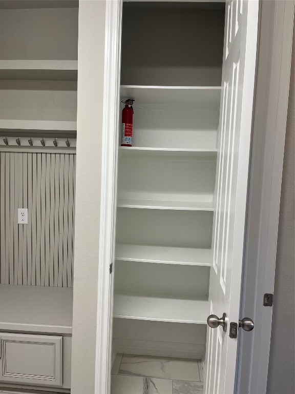 9452 Caddo Ridge Lane Cypress, TX 77433 - Photo 13 of 35 a view of walk in closet with empty racks