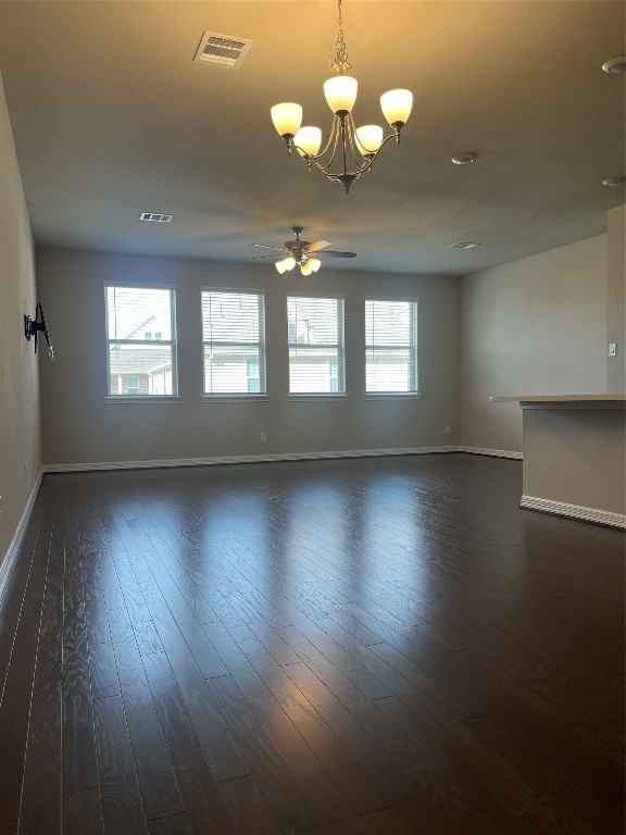 9452 Caddo Ridge Lane Cypress, TX 77433 - Photo 15 of 35 an empty room with wooden floor and windows