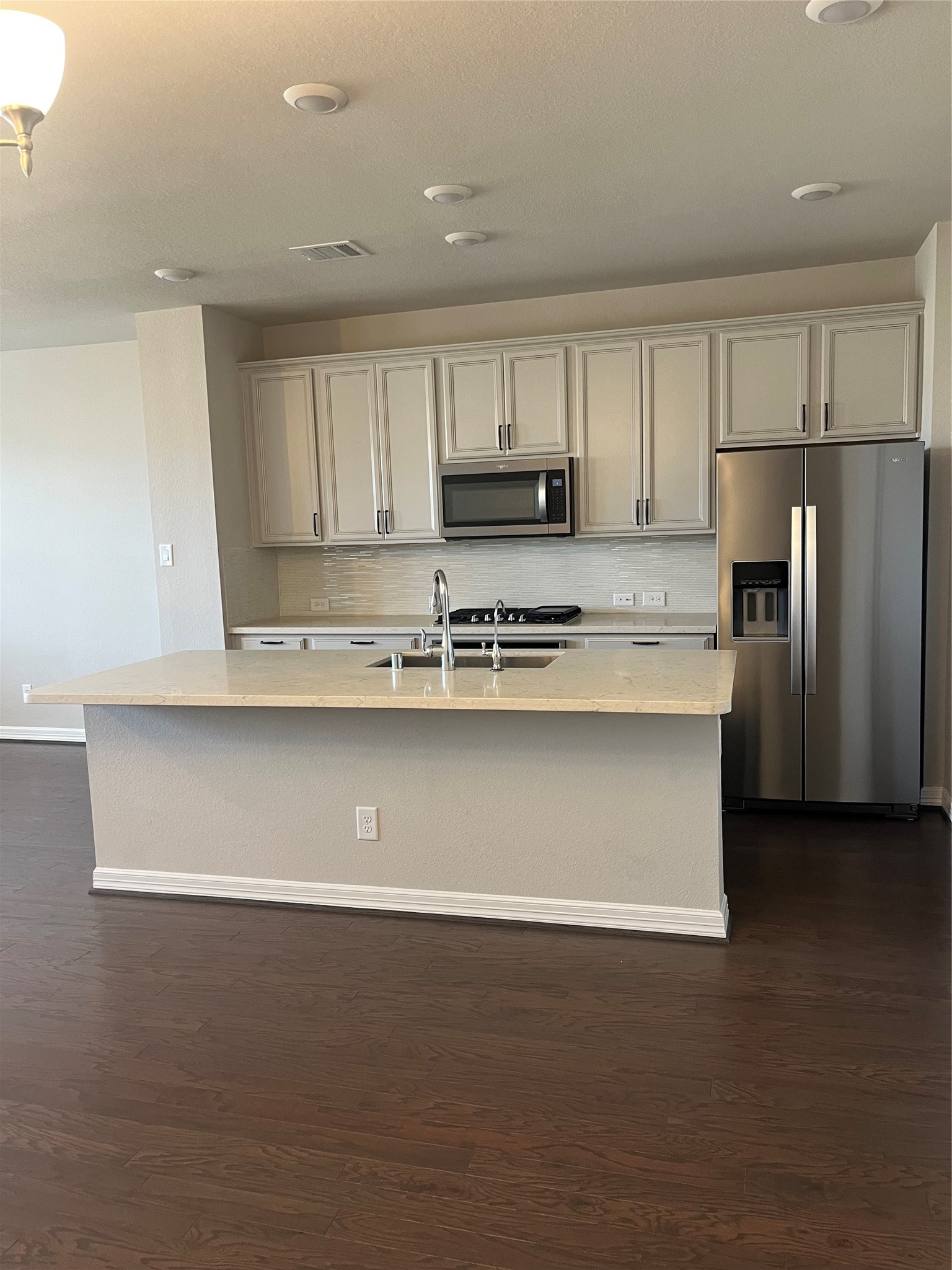 9452 Caddo Ridge Lane Cypress, TX 77433 - Photo 17 of 35 a view of kitchen with stainless steel appliances granite countertop a stove a refrigerator a sink dishwasher and a refrigerator with wooden cabinets