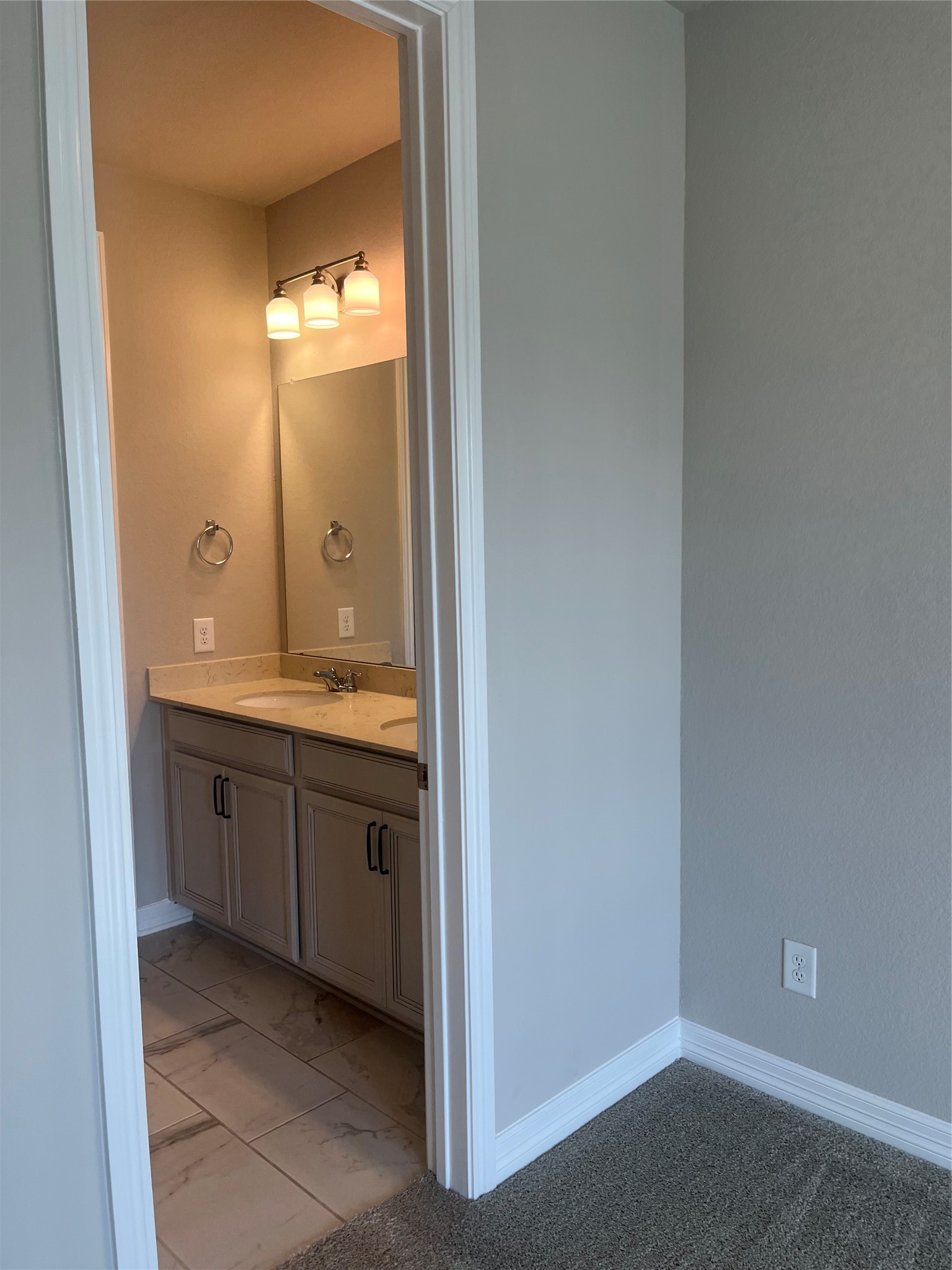 9452 Caddo Ridge Lane Cypress, TX 77433 - Photo 28 of 35 a bathroom with a granite countertop sink and mirror